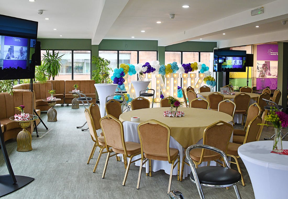 John Rylands Rooftop event space with elegant tables, ideal for meetings and social events.