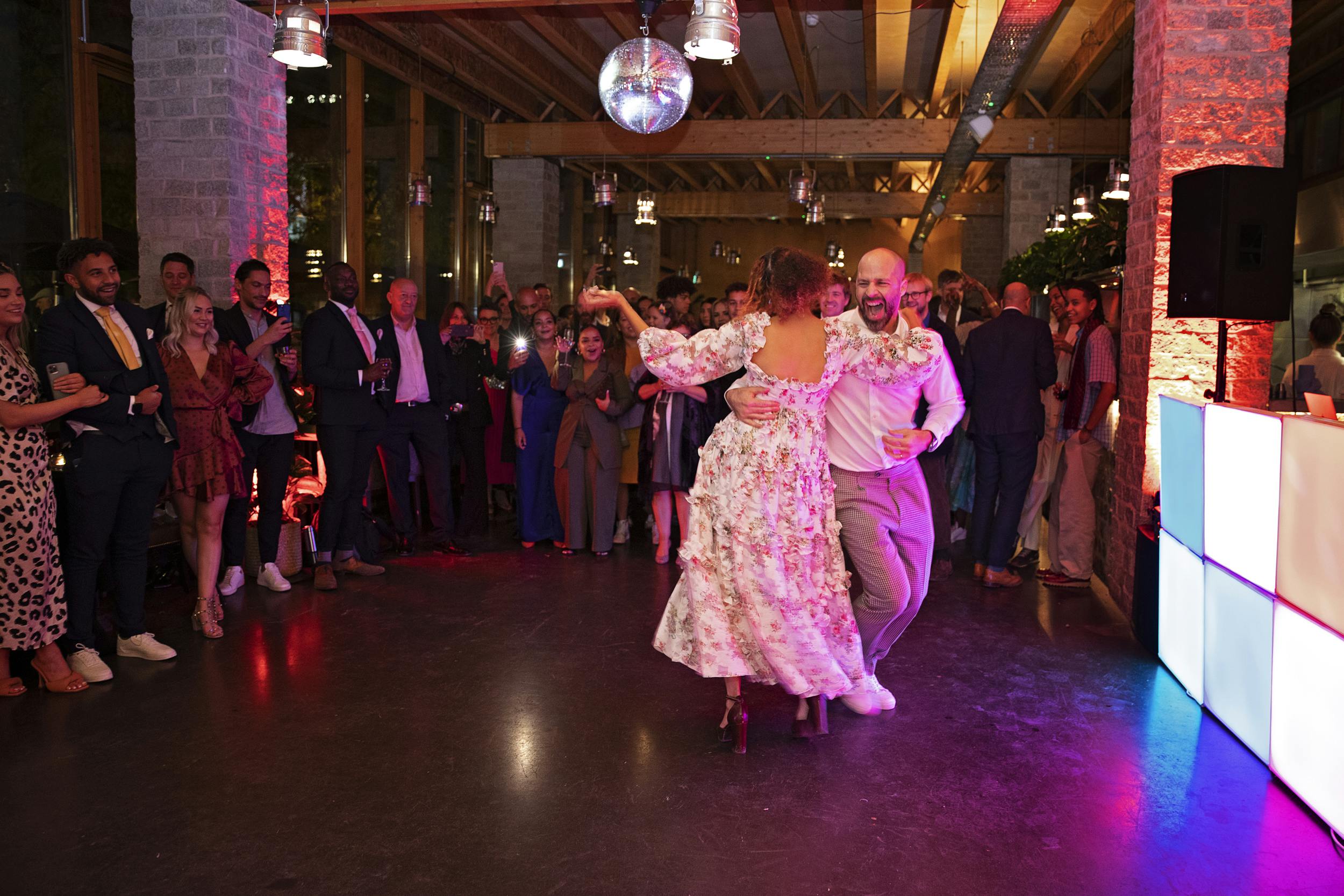 Vibrant event in The Greenroom with guests enjoying a lively dance performance.