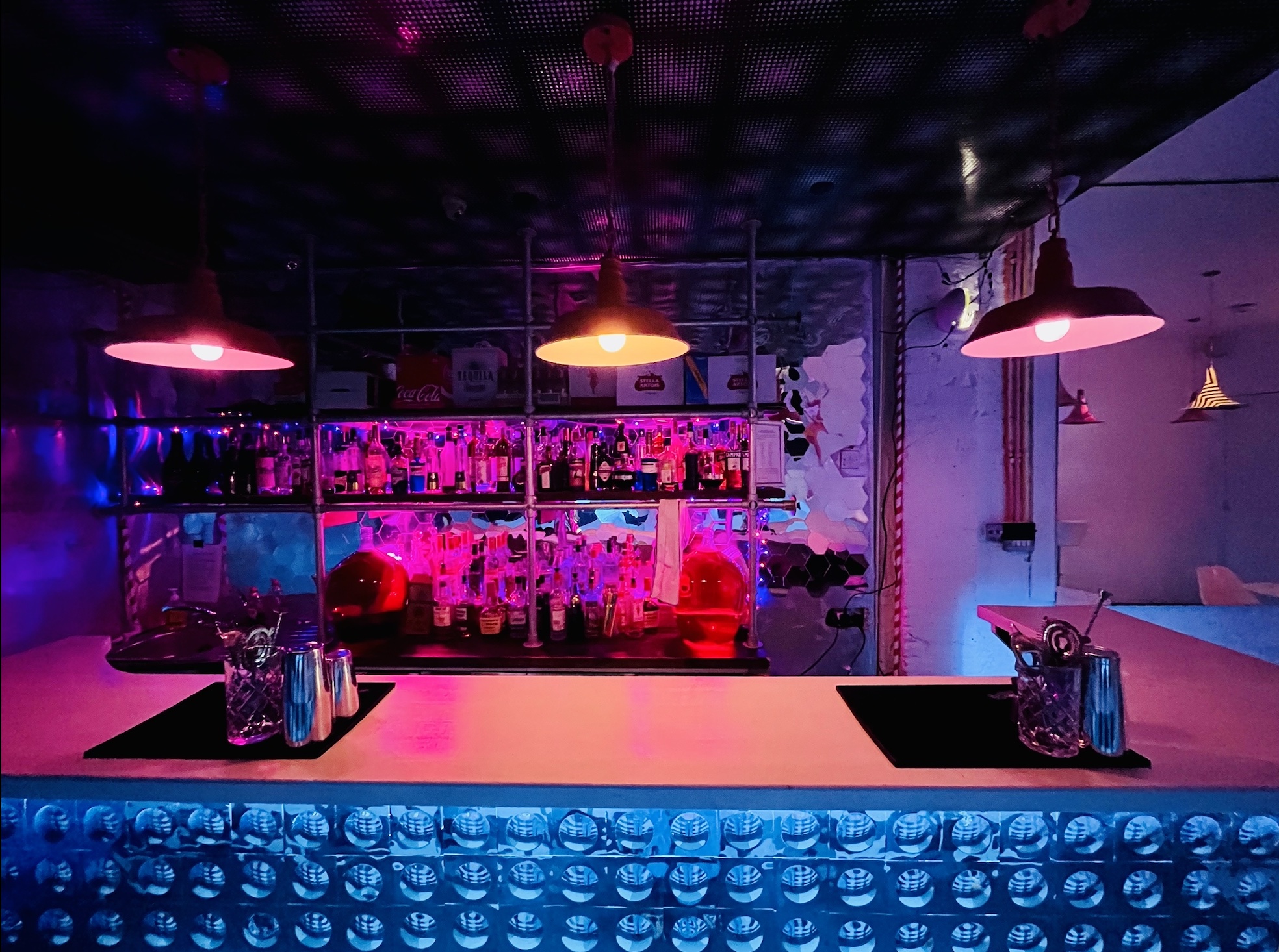 Vibrant Bonkers Bar with colorful lighting, ideal for cocktail receptions and networking events. - Banner