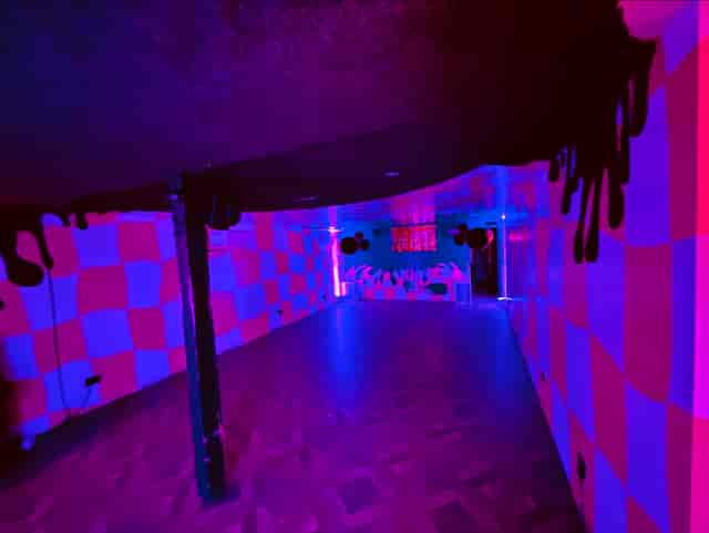 Vibrant Bonkers Bar event space with checkerboard patterns, perfect for parties and gatherings.