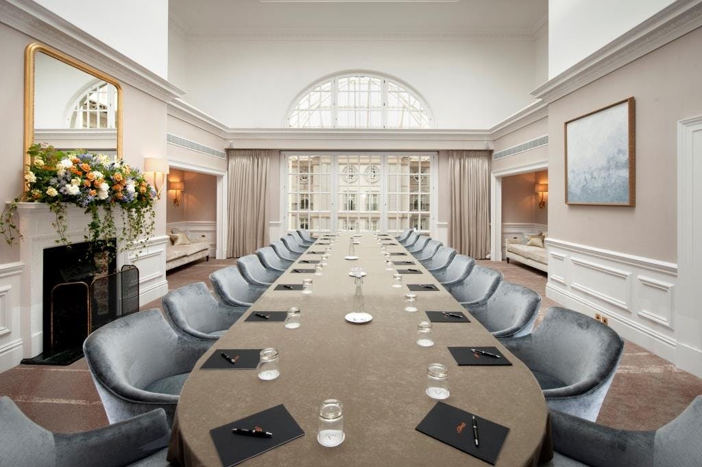 Elegant Tower Suite meeting room with plush seating, perfect for corporate events.