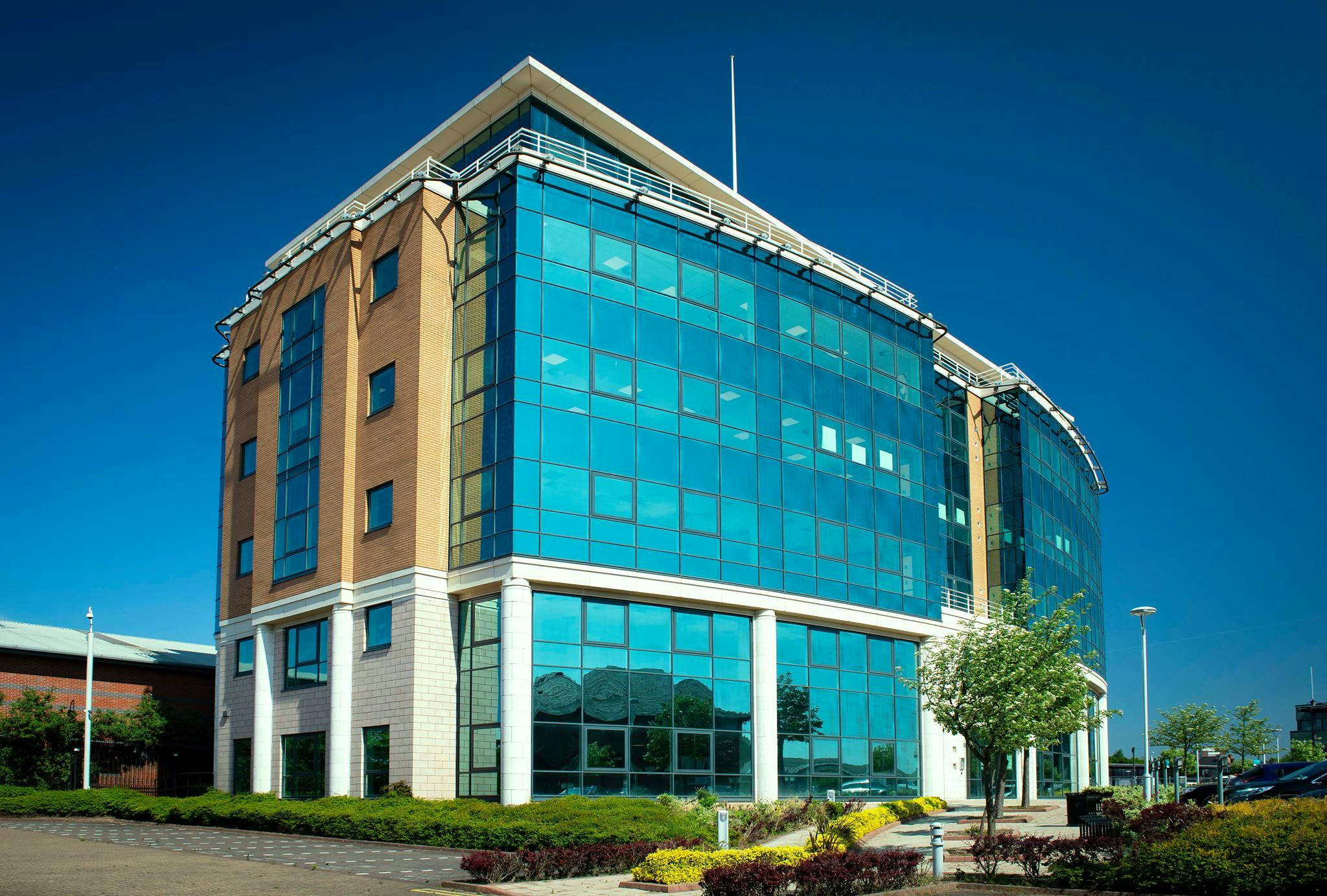 Modern multi-story office building with glass facade, ideal for corporate events in Birmingham.