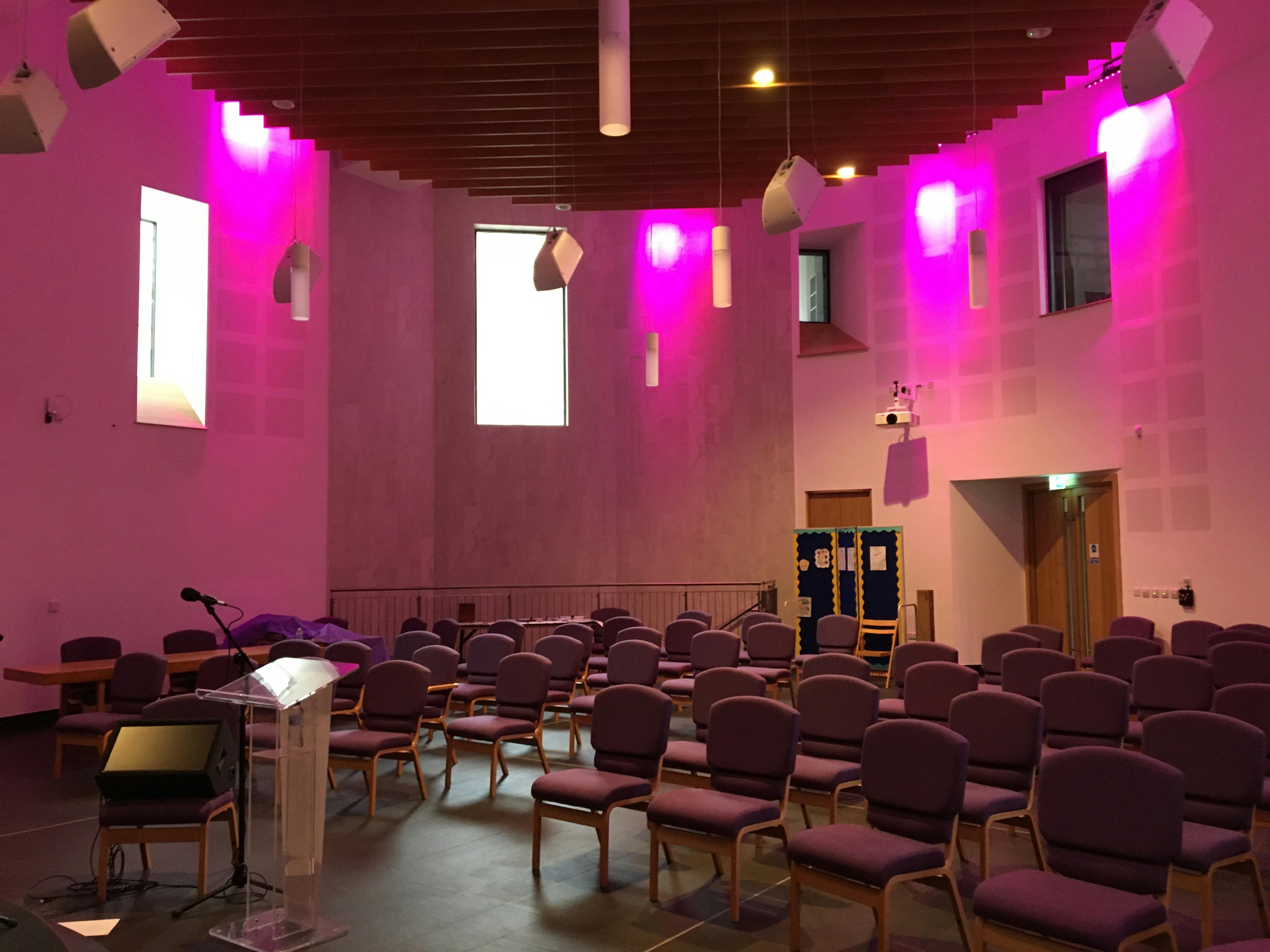 Performance Hall in Tab Centre with flexible seating and purple accents for events.