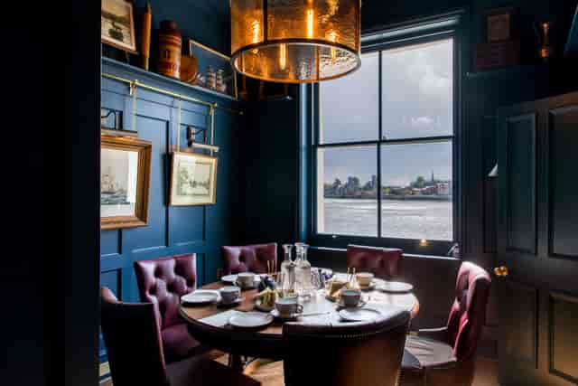 Intimate dining space in Enderby House, ideal for private events and meetings.