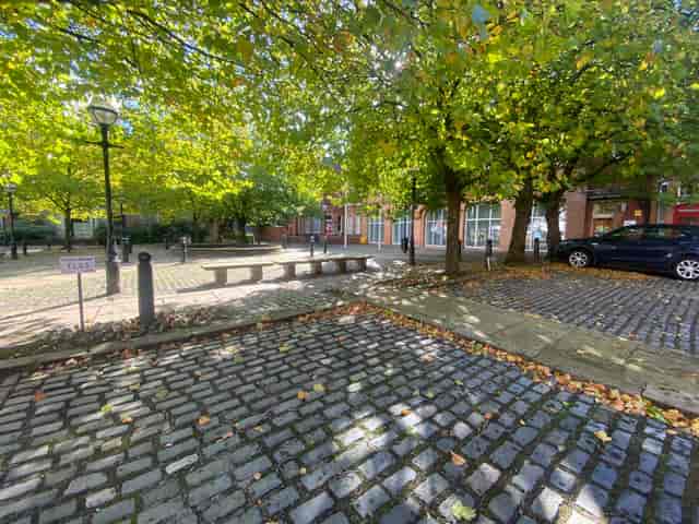 Outdoor venue at Albert Bentley Place with cobblestone paths for networking events.