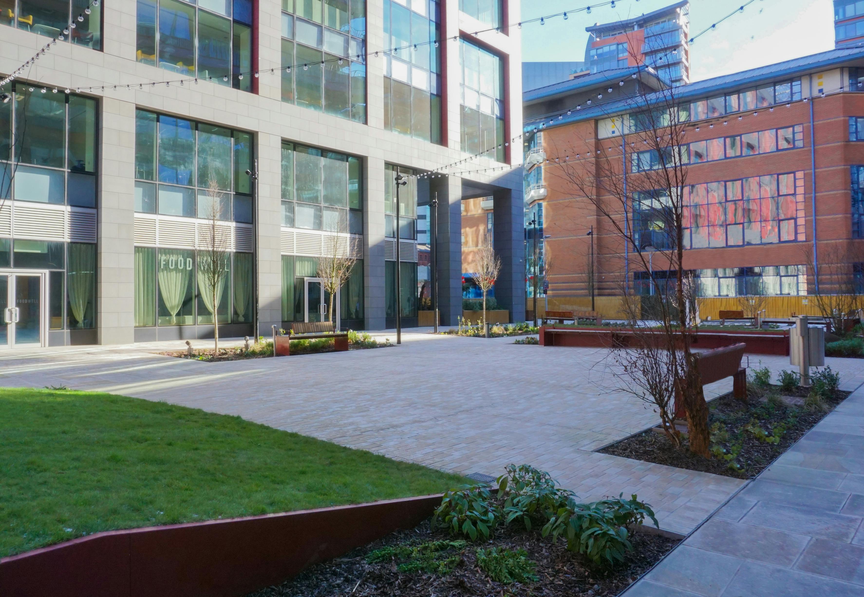 Versatile outdoor venue in New Bailey Square with modern architecture for events.