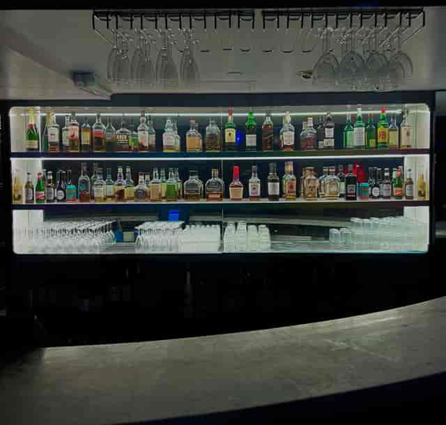 The KingPin Suite bar with premium spirits, perfect for cocktail receptions and networking events.