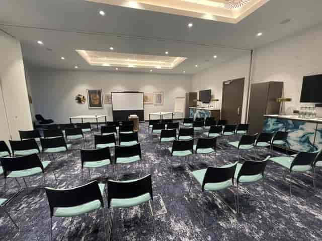 Bucksburn Suite meeting room with black chairs, ideal for presentations and workshops.