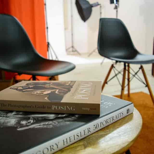 Photography workshop setup in Studio 5 Manchester with stylish chairs and books.