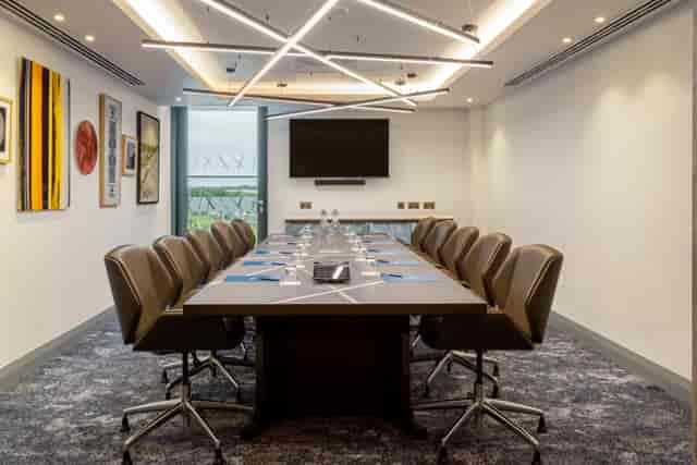 Modern conference room in Hilton Aberdeen TECA with sleek table for corporate events.