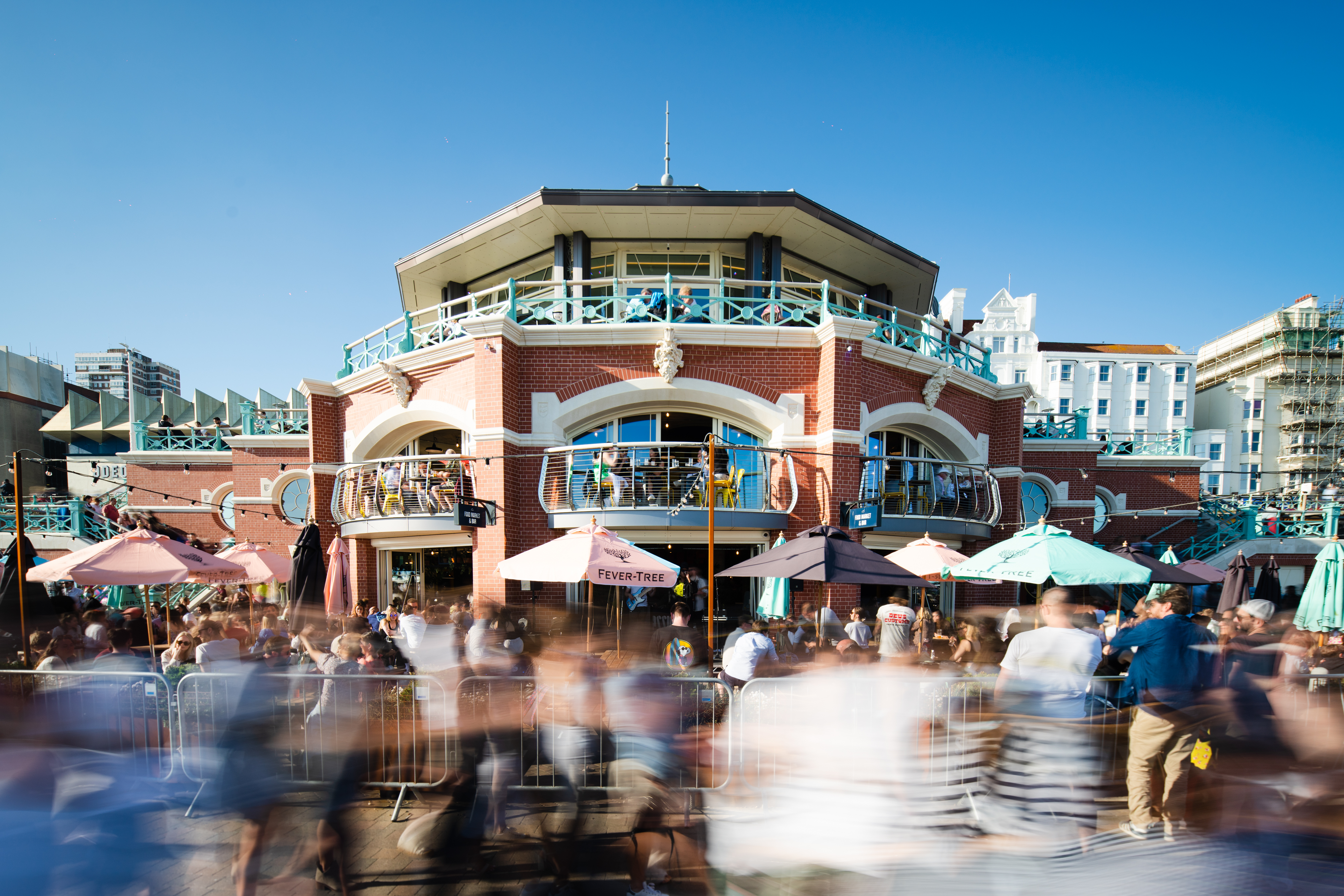 Vibrant Shelter Hall venue with outdoor seating for networking events and gatherings. - Banner