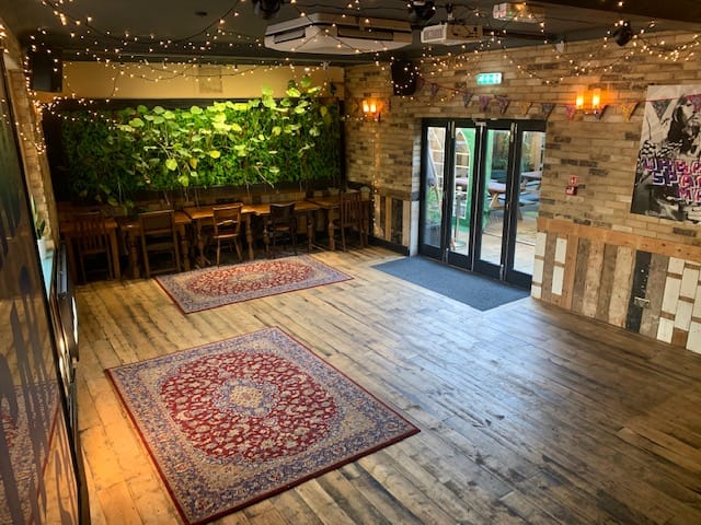 Function Room at The Village Green: warm, versatile event space for gatherings and meetings.