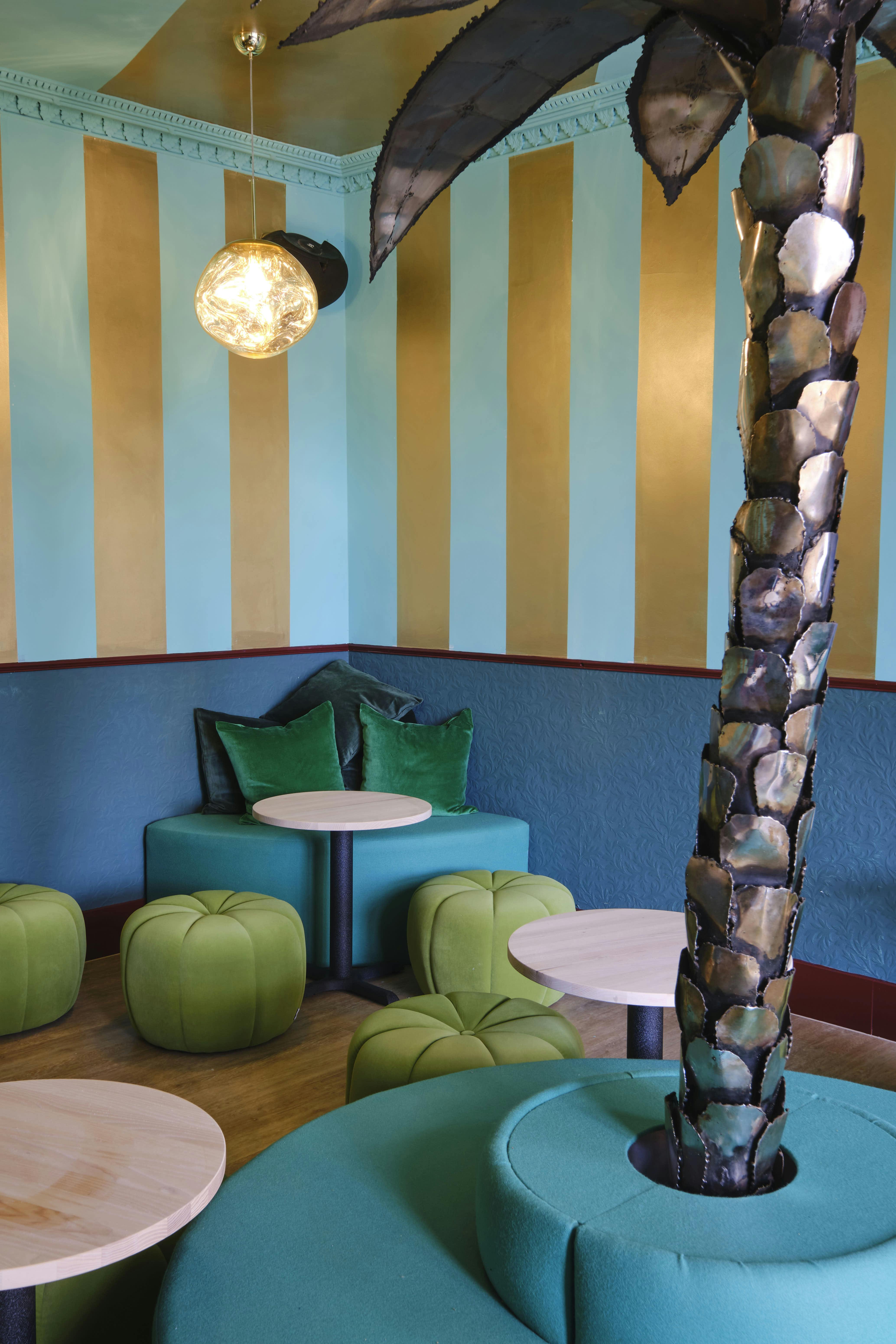 Vibrant Miami Bay meeting space with bold blue and gold stripes, perfect for events.