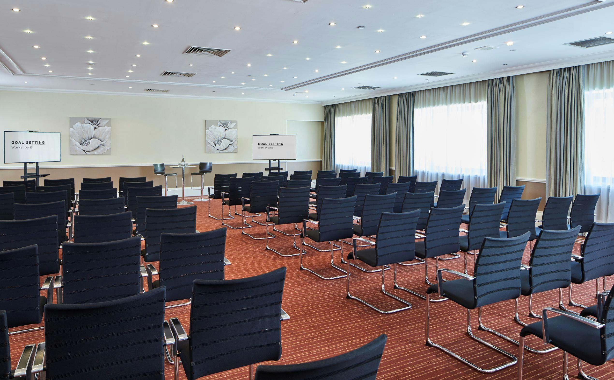 Heritage Suite meeting room at Portsmouth Marriott, modern chairs for workshops and presentations.