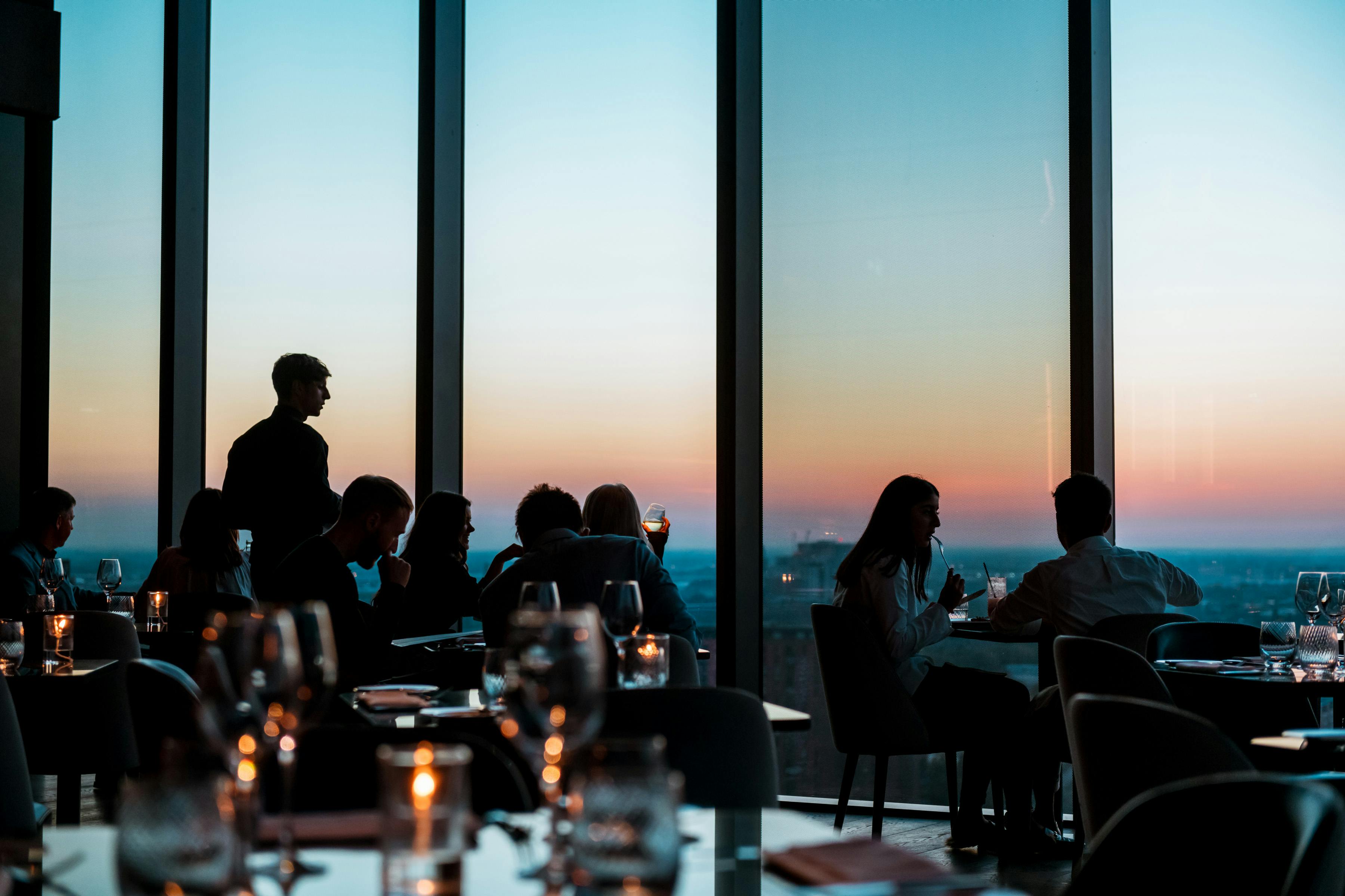 Upscale dining at 20 Stories Restaurant with sunset view, perfect for events and celebrations.