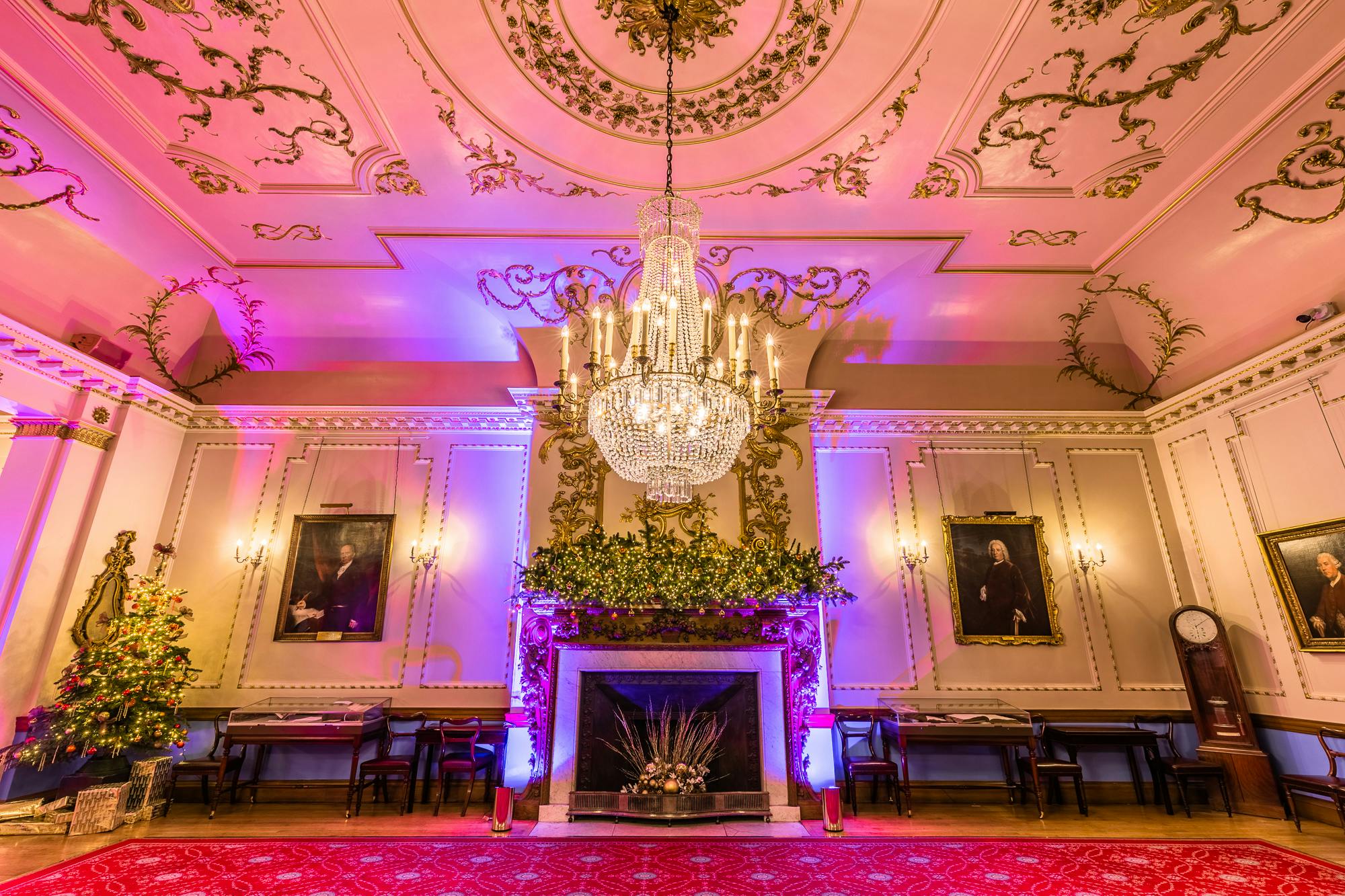 Elegant event space with grand chandelier, ideal for corporate events and formal receptions.