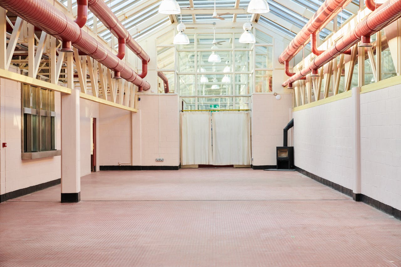 Hackney Depot Main Hall: spacious event space with high ceilings for meetings and gatherings.