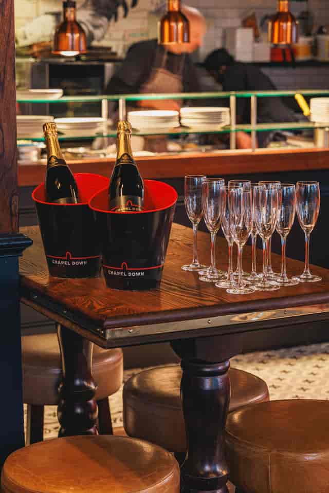 Elegant champagne setup with flutes at Balls Brothers Austin Friars for weddings and events.