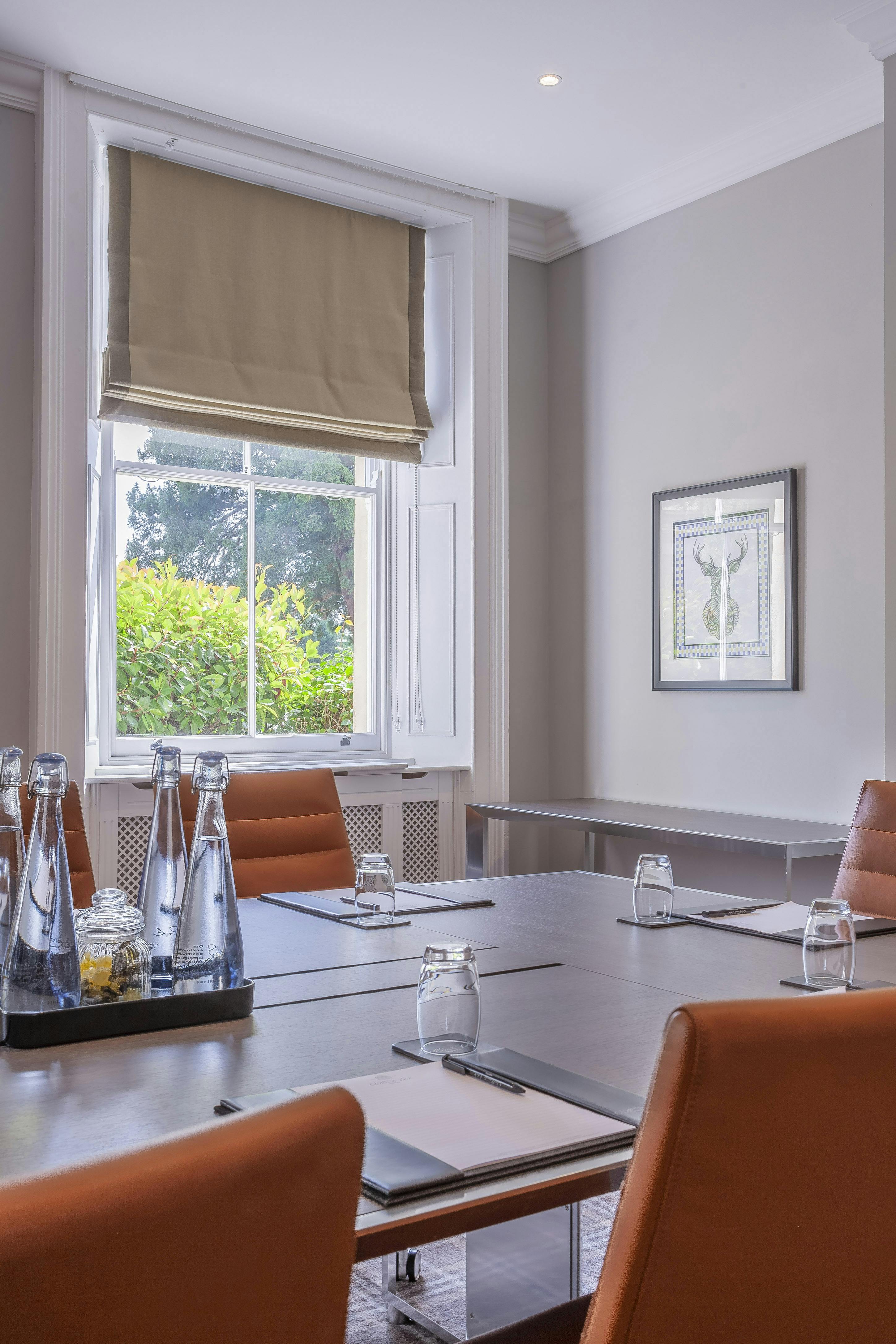 Surrey Room at Oatlands Park Hotel, modern meeting space with natural light for events.