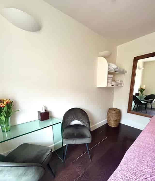Serene treatment room with minimalist design for wellness and breakout sessions.