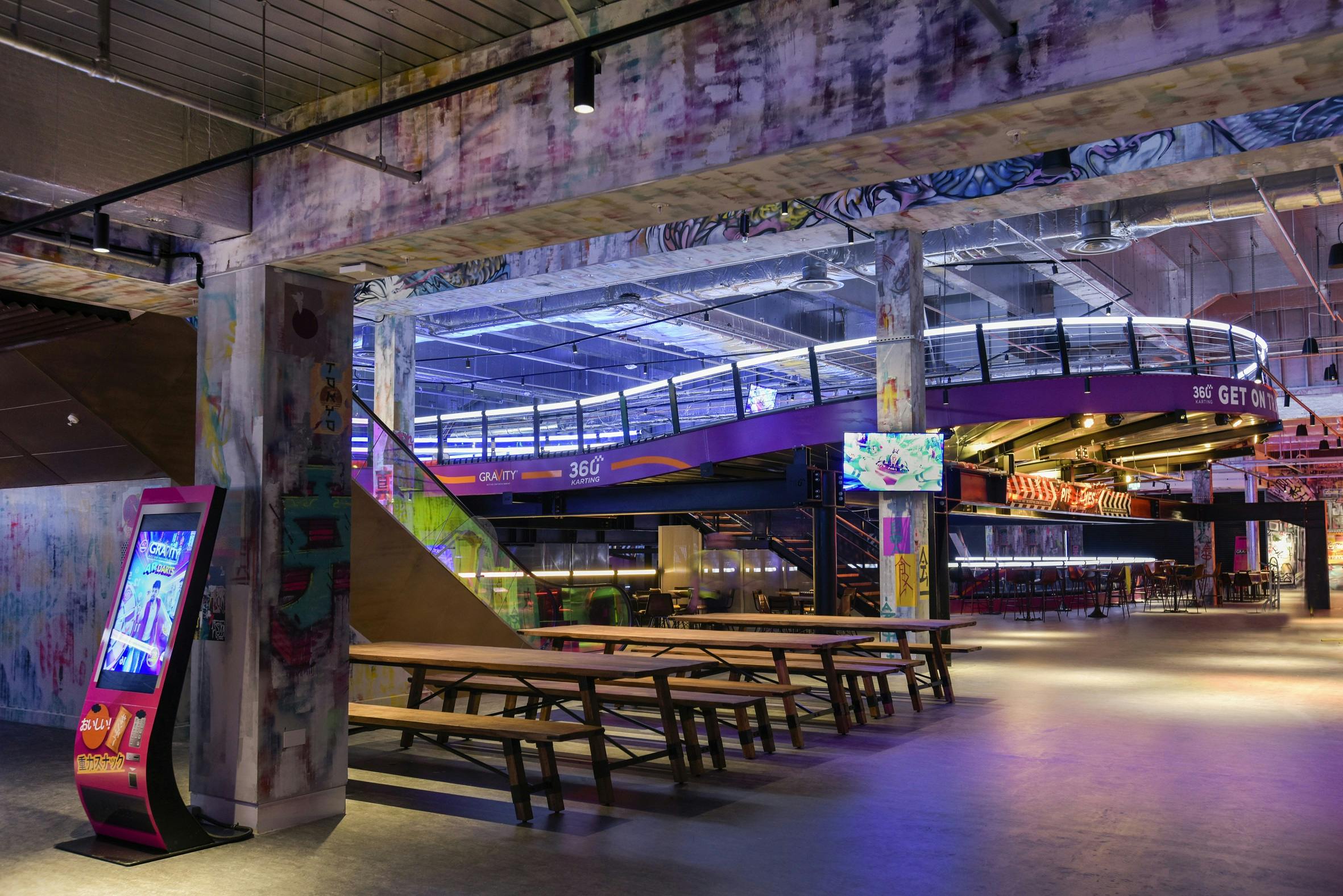 Vibrant Gravity MAX Wandsworth event space with colorful graffiti for networking and workshops.