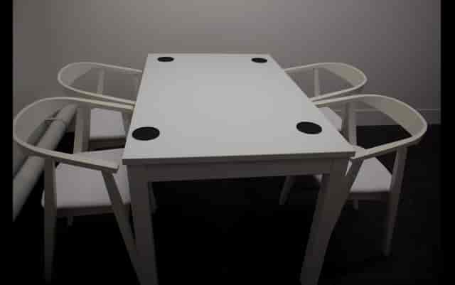 Creative studio space with minimalist meeting setup for podcasts and brainstorming sessions.