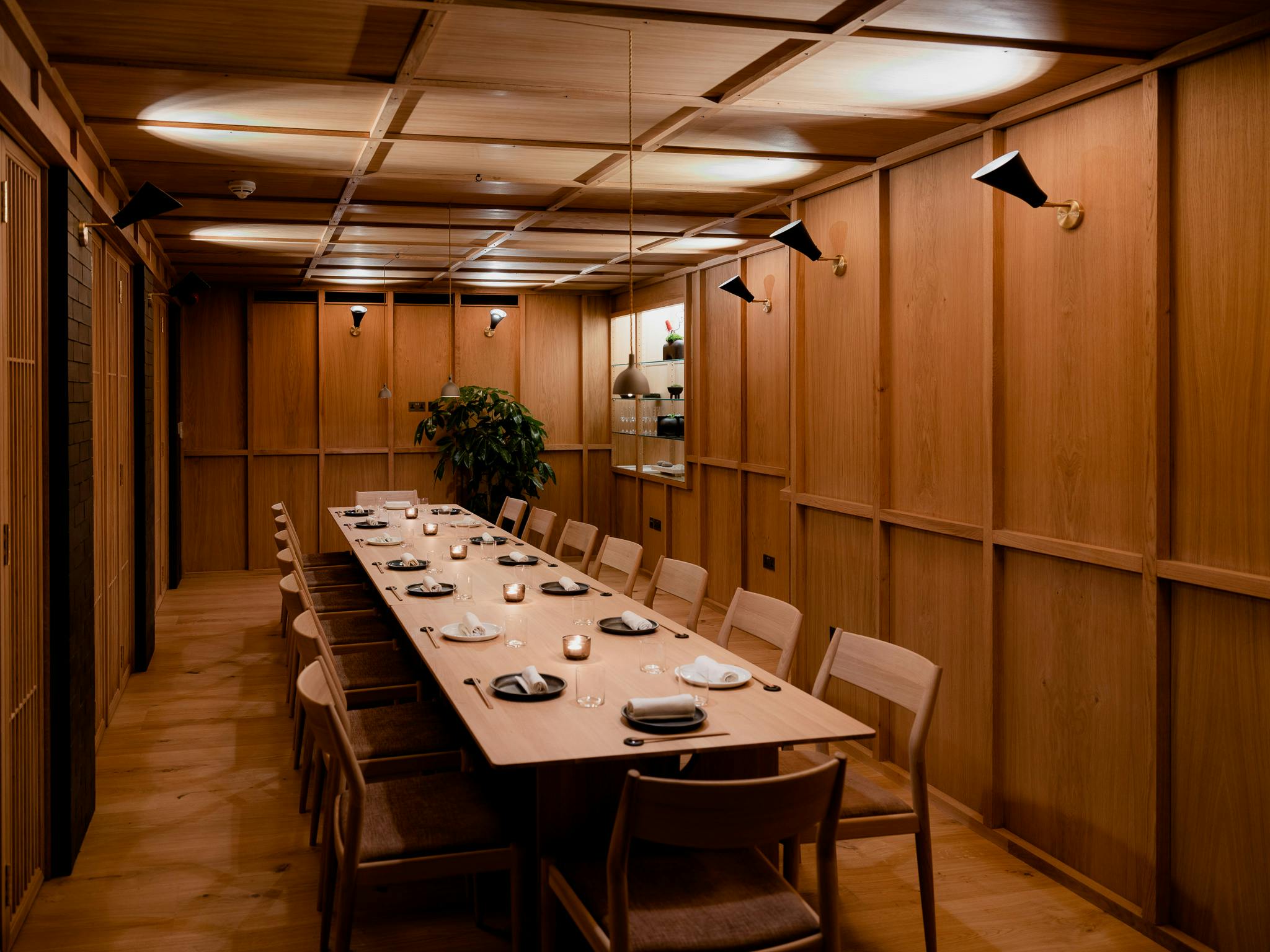 Sachi private meeting room with warm wood paneling for intimate gatherings and events.