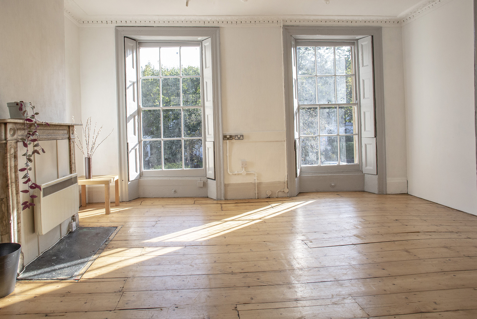 Bright, airy event space with large windows, ideal for meetings and workshops. - Banner
