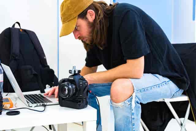 Focused professional editing footage in creative Blankbox Studio for event marketing.
