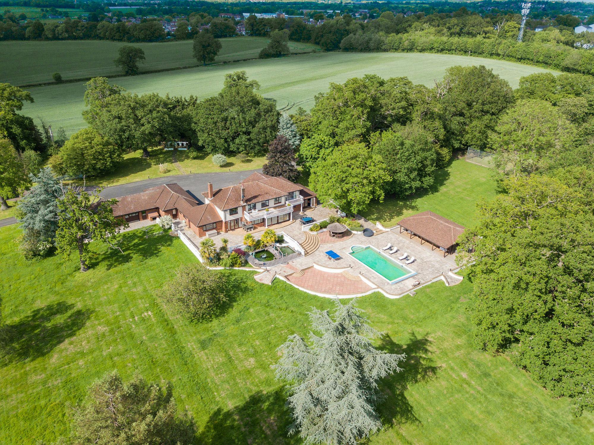 Villa Mansion outdoor venue with spacious lawn, ideal for retreats and social events.