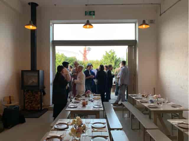 Stylish autumn event space with elegant table setup for gatherings and meetings