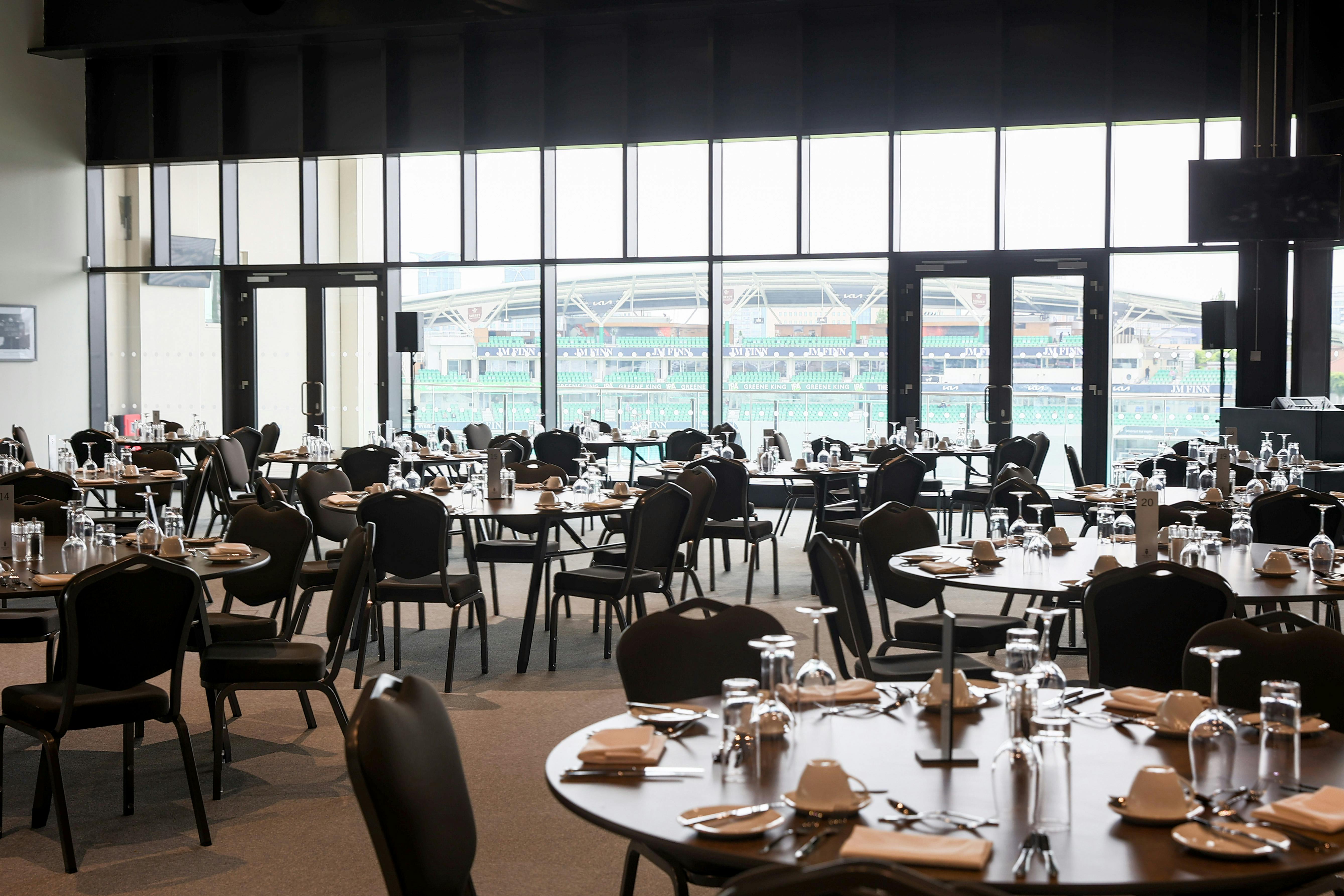 Duchy Suite at Kia Oval: elegant event space with round tables for corporate events and banquets.