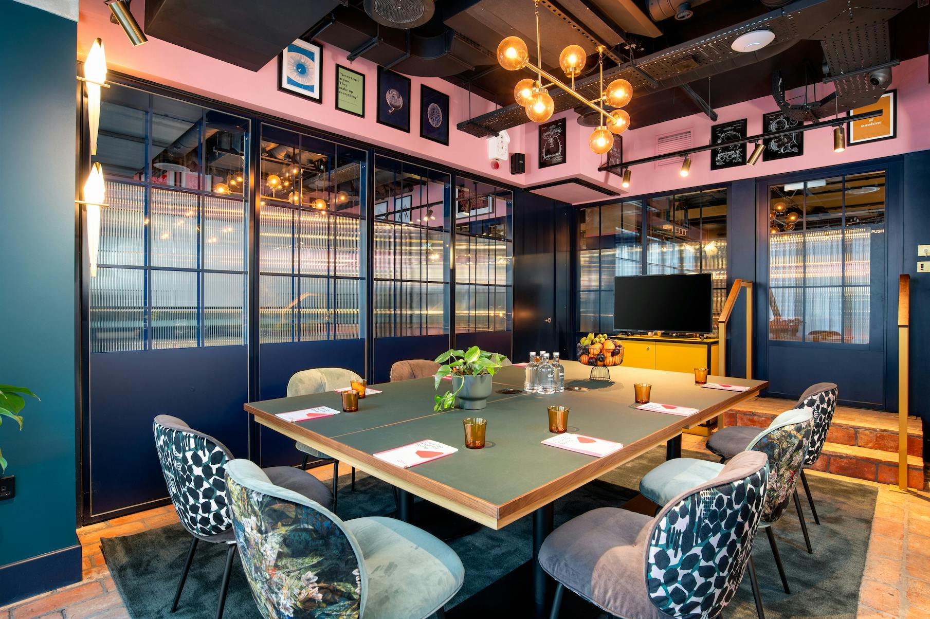 Stylish meeting room at Yotel Manchester with vibrant decor for creative events.