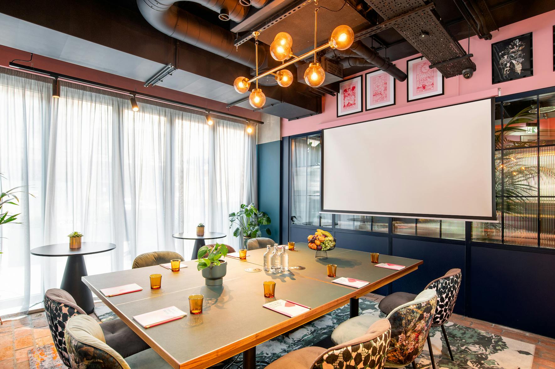 Stylish meeting room at Yotel Manchester with natural light, ideal for brainstorming sessions.