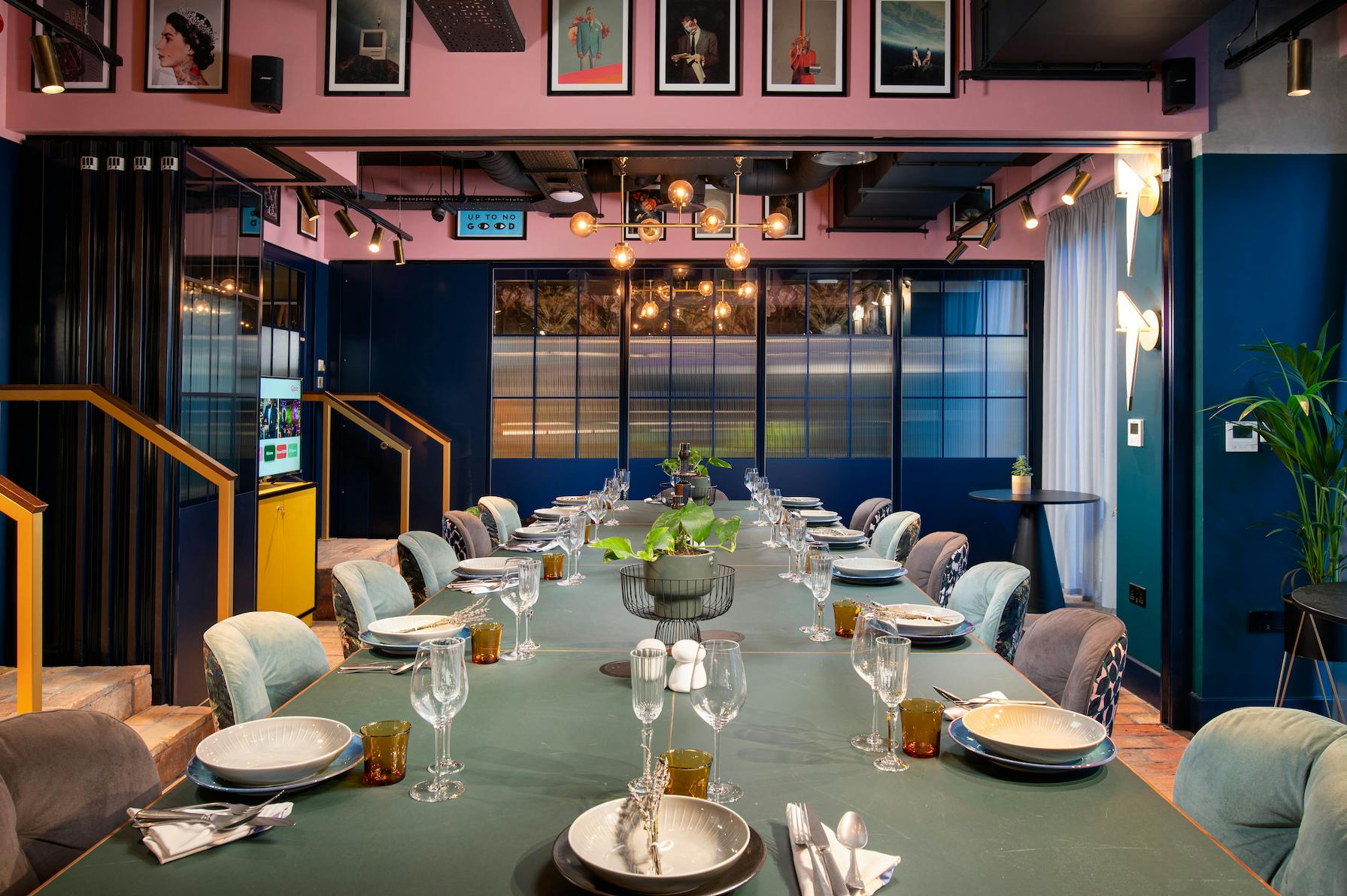 Stylish meeting space at Yotel Manchester with elegant table settings for corporate events.