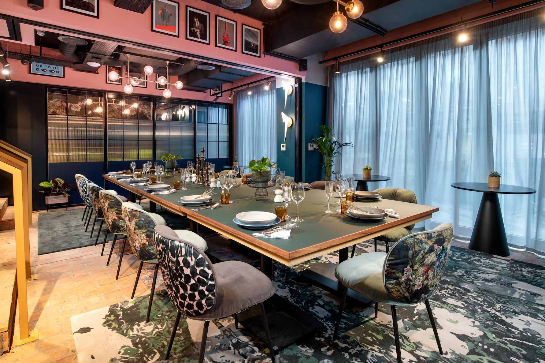 Stylish meeting space at Yotel Manchester with elegant tableware for corporate events.