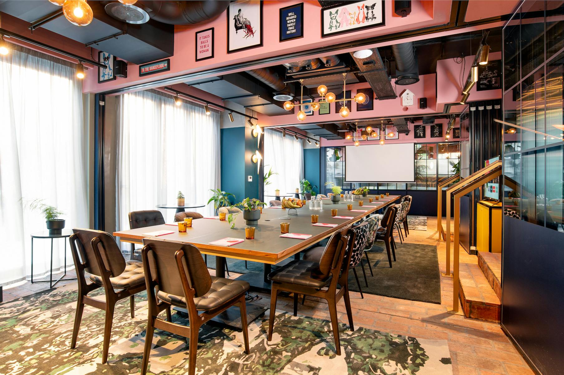 Modern meeting space at Yotel Manchester with natural light for workshops and presentations.