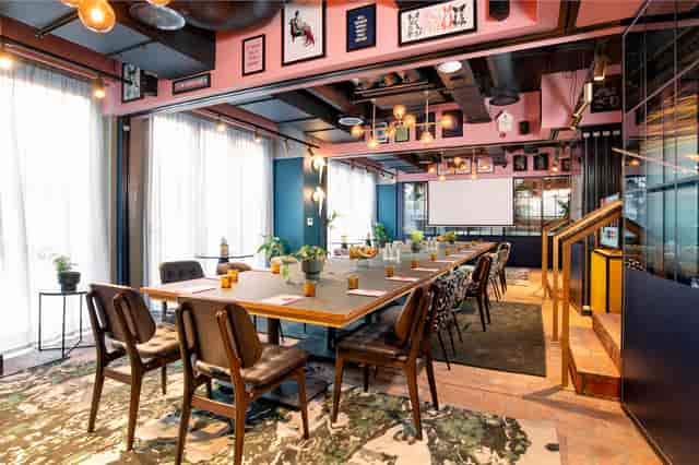 Modern meeting space at Yotel Manchester with natural light for workshops and presentations.