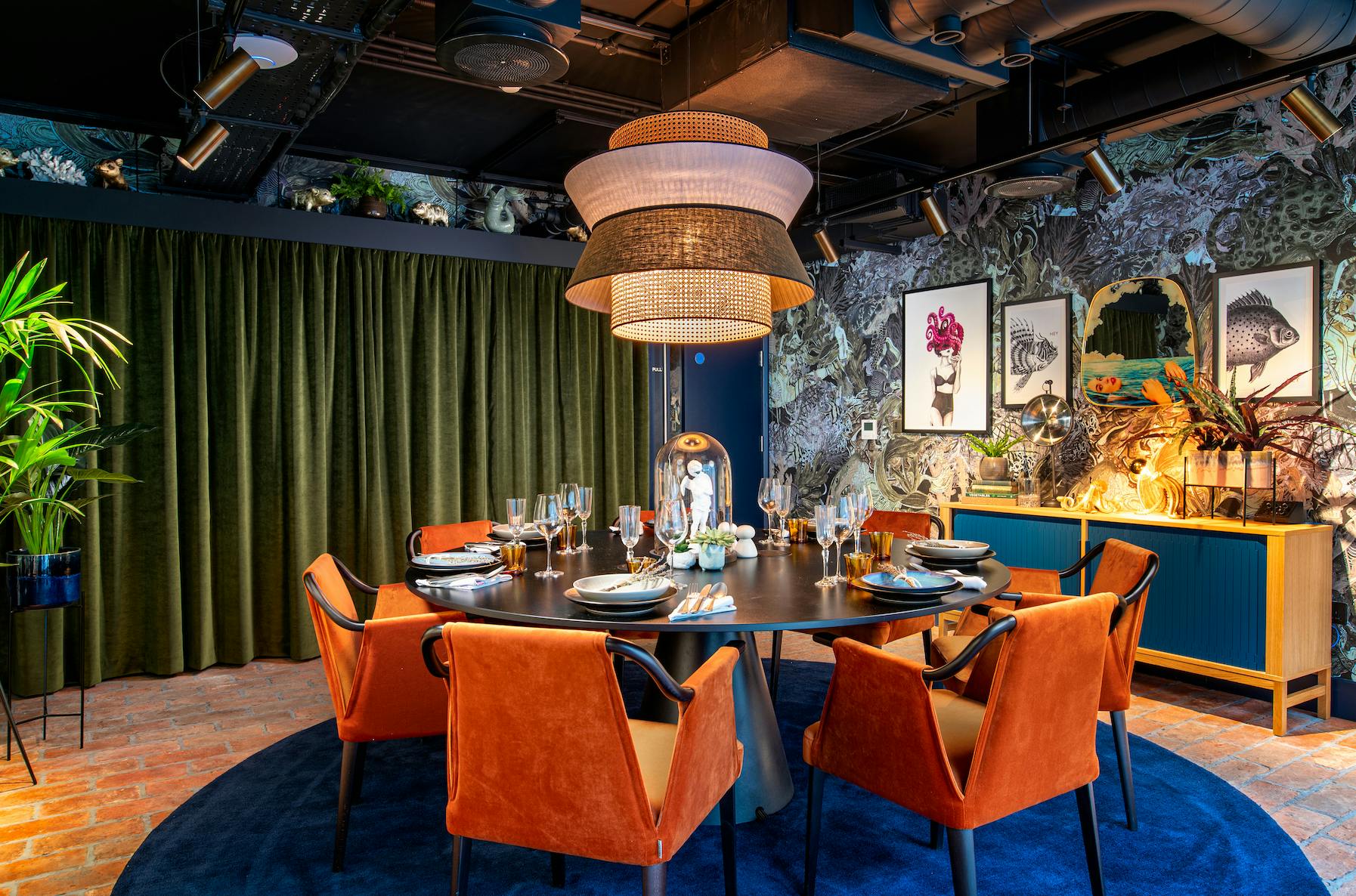 Intimate dining setup at Yotel Manchester with vibrant chairs for private events.