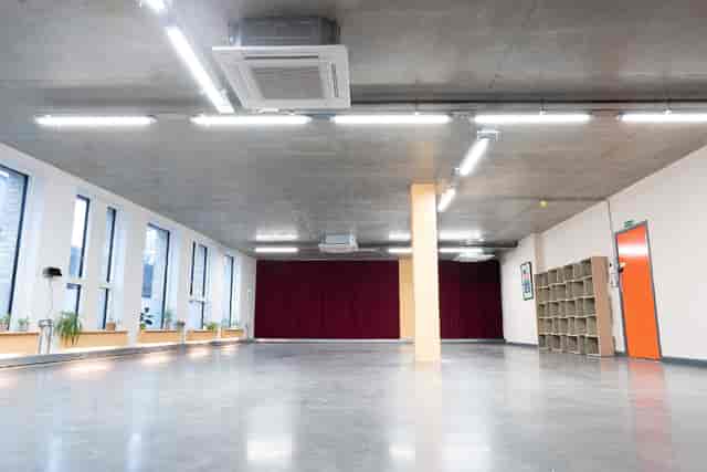 Versatile event space with natural light, ideal for workshops and seminars.