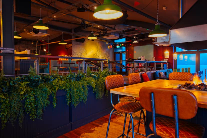 Stylish event space at The Terrace, Revolution Aberdeen with warm lighting and greenery.