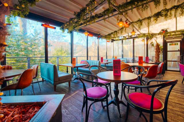 Stylish event space at The Terrace, Revolution Aberdeen with vibrant seating and natural light.