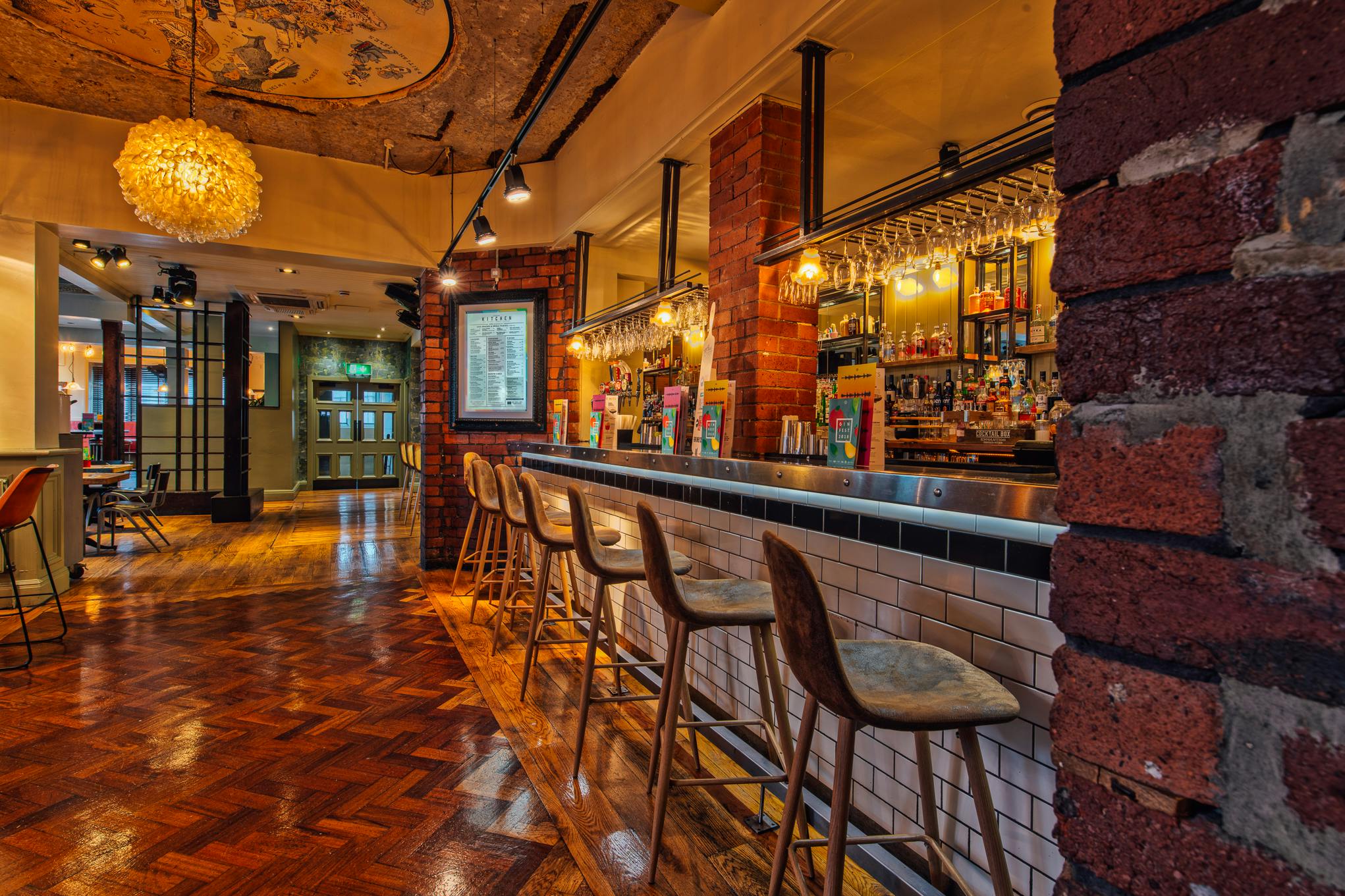 Stylish bar area in Revolution Huddersfield for networking events and gatherings.