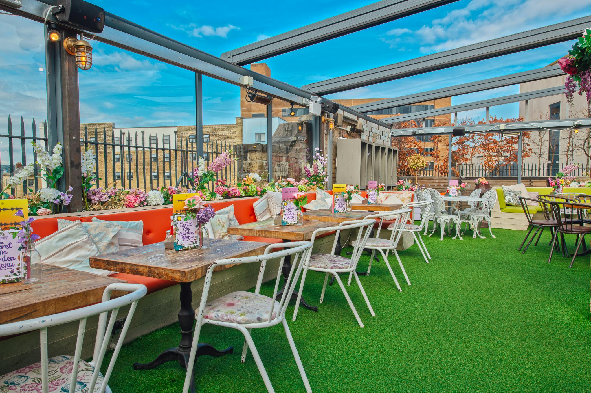 Vibrant rooftop venue with stylish seating for events in Revolution Huddersfield.
