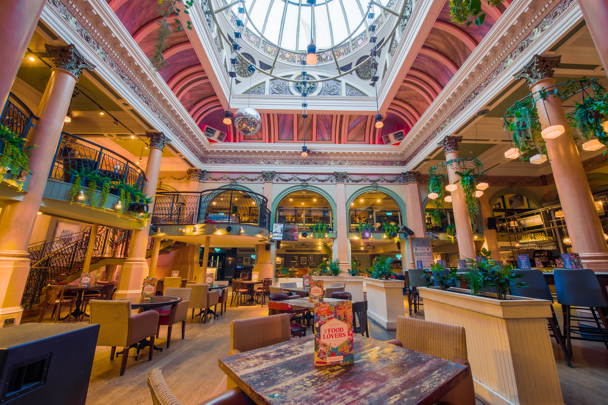 Mezzanine at Revolution De Cuba Belfast, featuring high ceilings for events and gatherings. - Banner