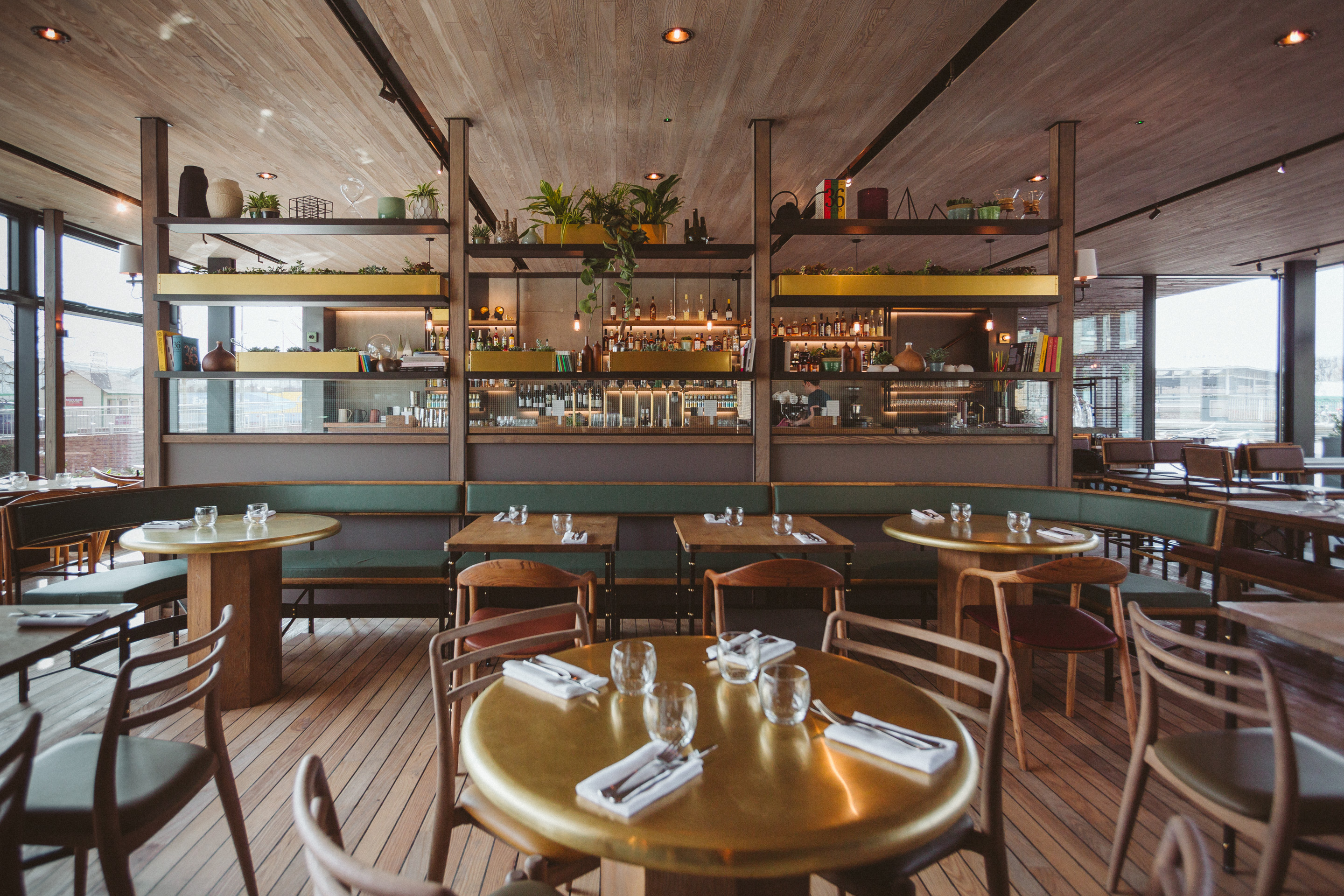 Modern dining space with wooden floors for intimate gatherings and events at The Lighterman. - Banner