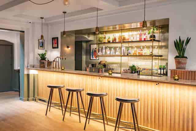 Stylish bar area in The Garden Room, ideal for networking events and cocktail receptions.