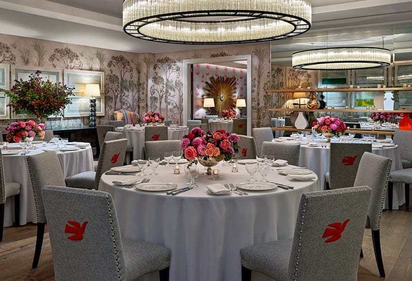 Elegant dining space with round tables for upscale events at The Crosby Street Hotel.