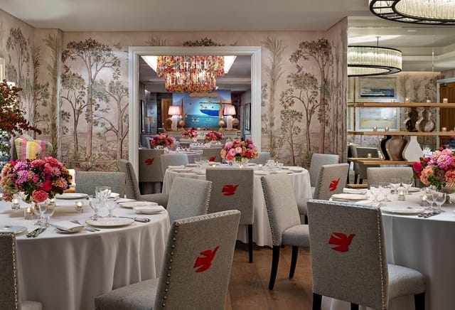 Elegant dining space with floral wallpaper for upscale events at The Crosby Street Hotel.