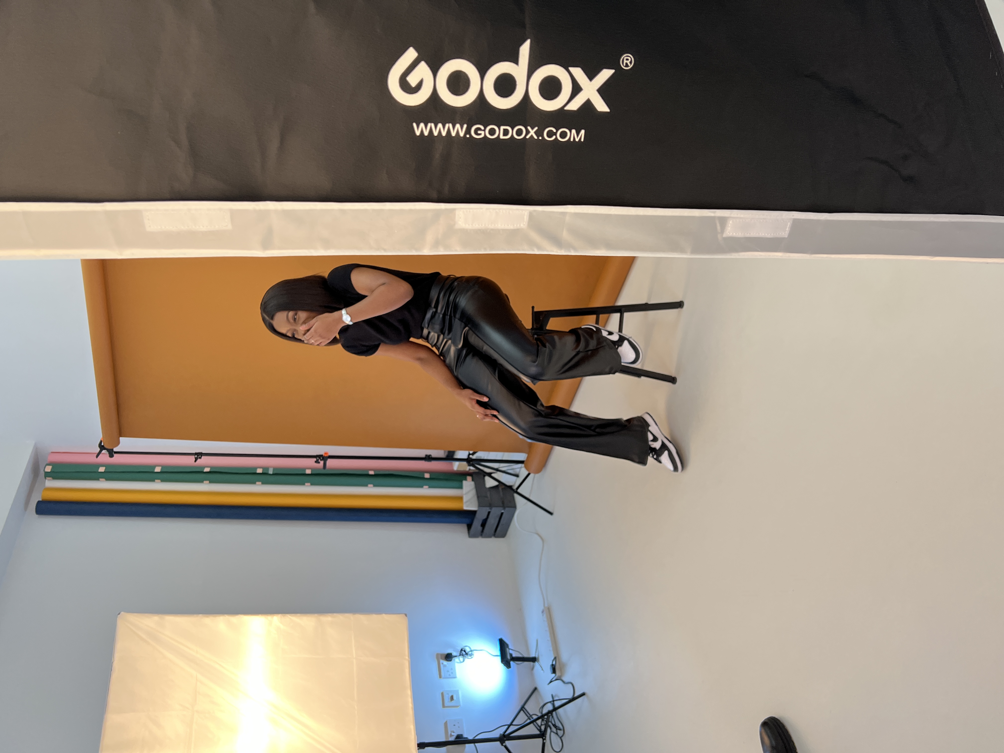 Professional photoshoot studio with model, ideal for branding events and promotions. - Banner